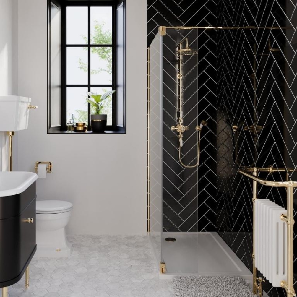Product Lifestyle image of the Burlington Gold Walk In Shower Enclosure with a Gold Glass to Wall Bracing Bar and a Hinged Deflector Panel